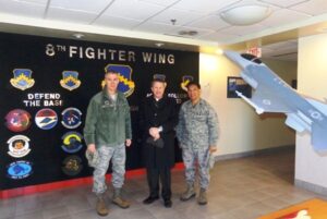 Archbishop Timothy Broglio in South Korea with Col. John W. Pearse, Commander at Kunsan Air Base (left) and Father Mario Catungal